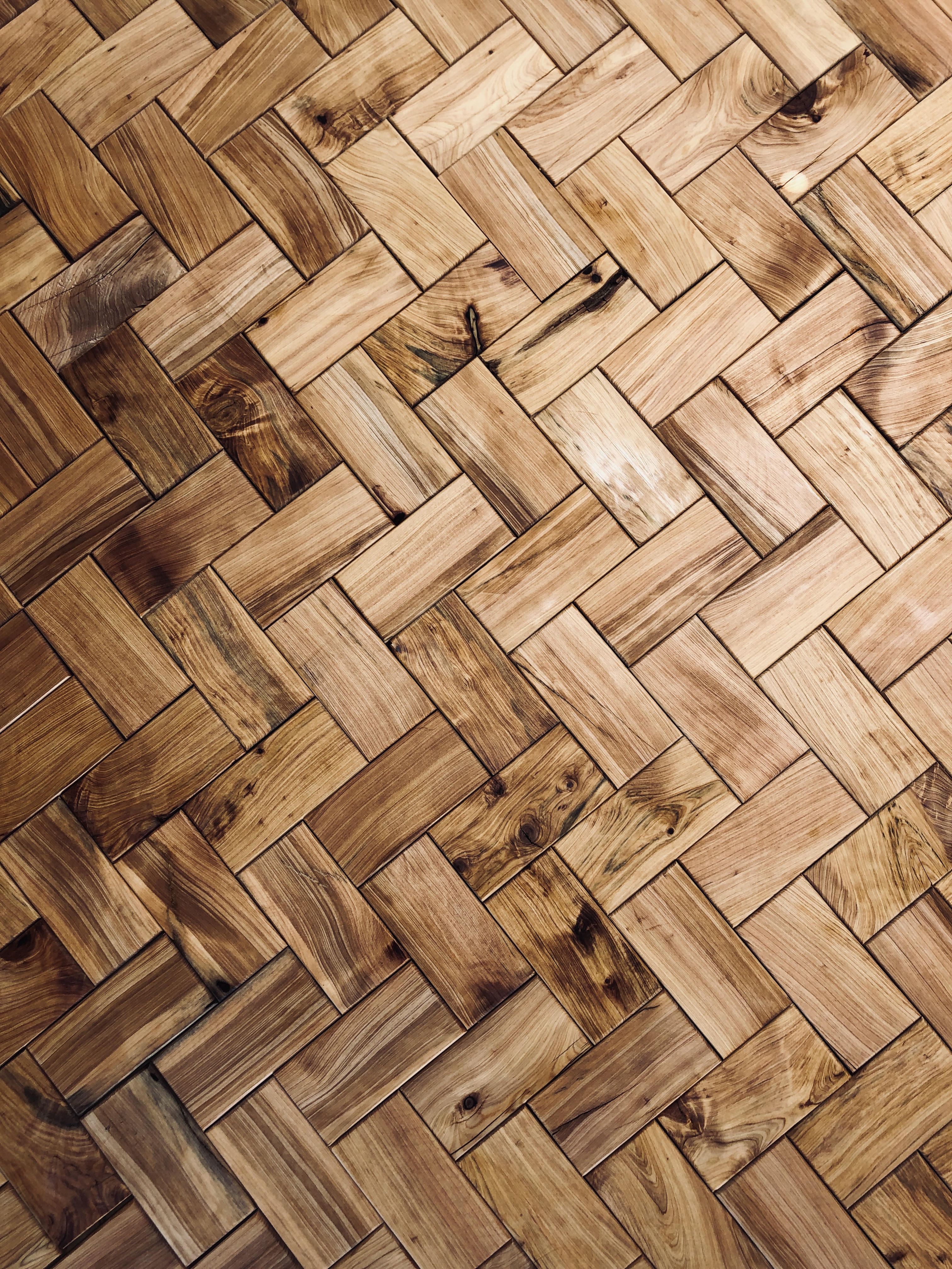 A Herring bone tile pattern of tiles made out of alligator Juniper